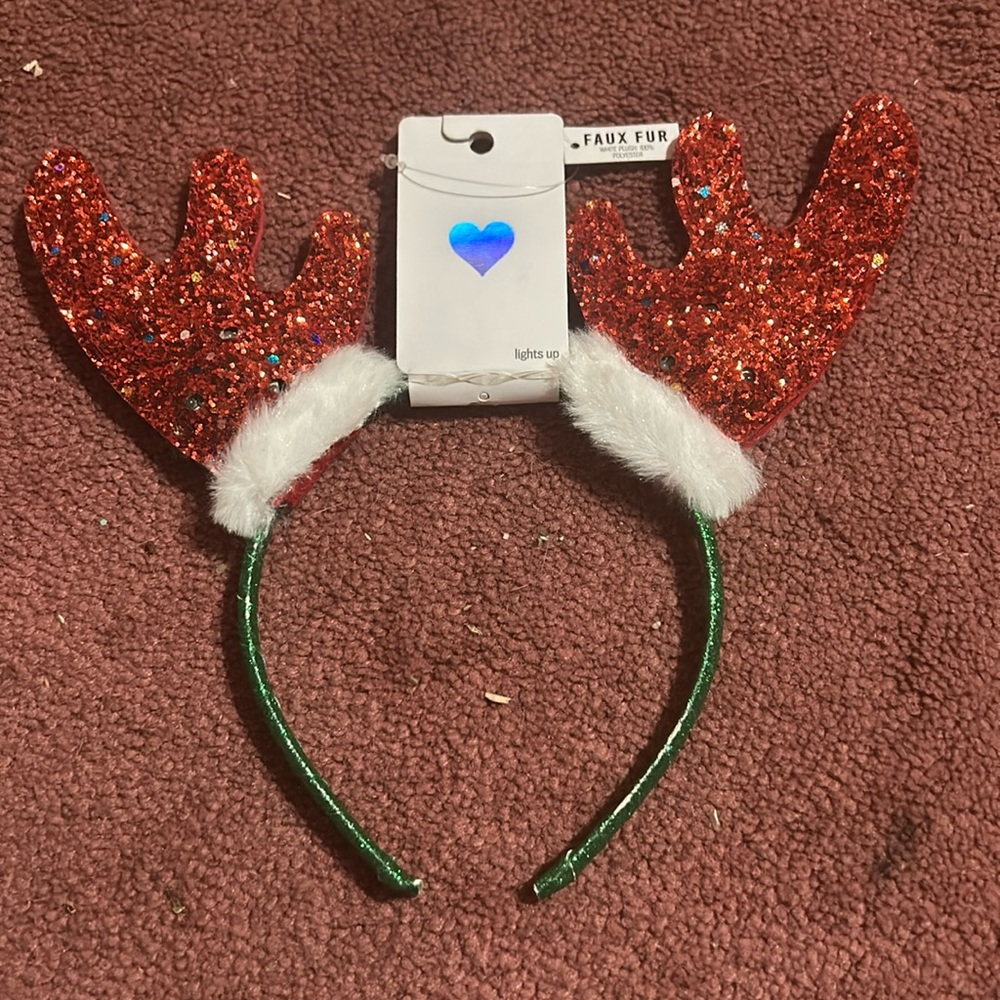 A reindeer headband; lights blink